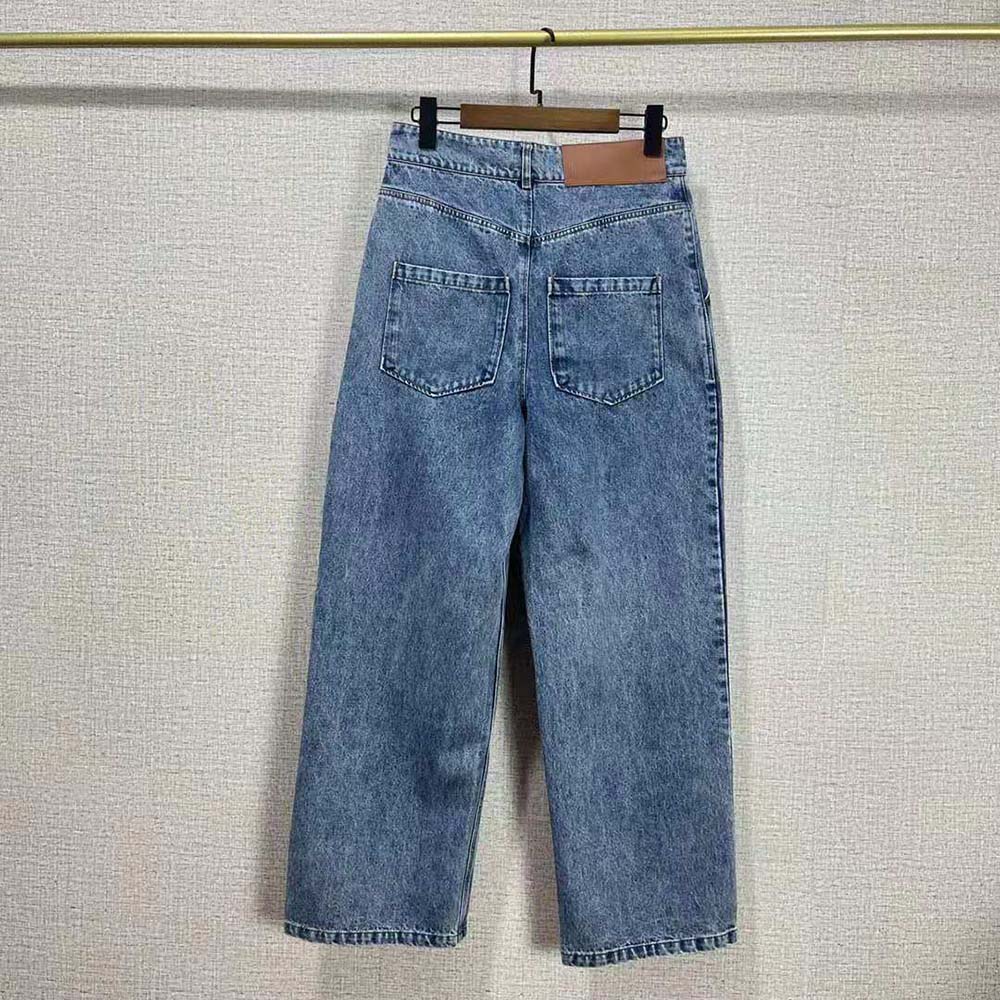 Side angle showing cropped length and slim fit of Loewe jeans