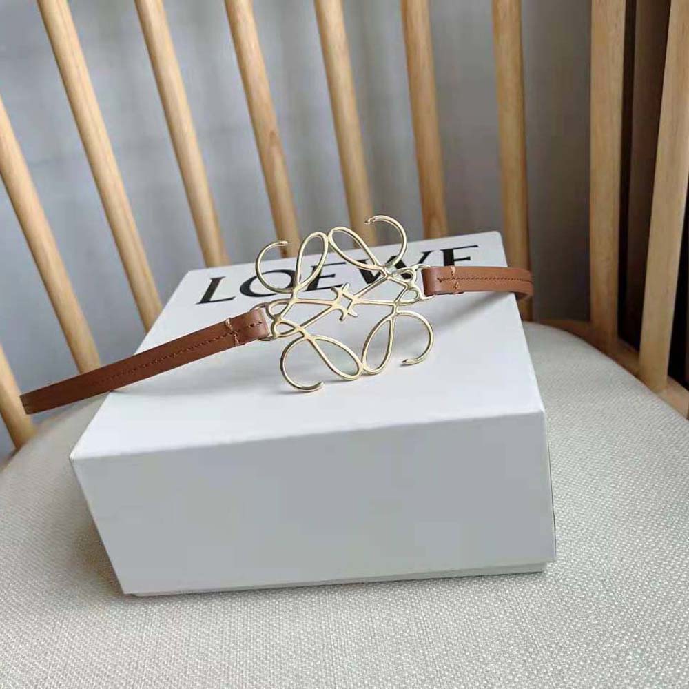 Close-up detail of polished gold Anagram buckle on Loewe Women Anagram Belt