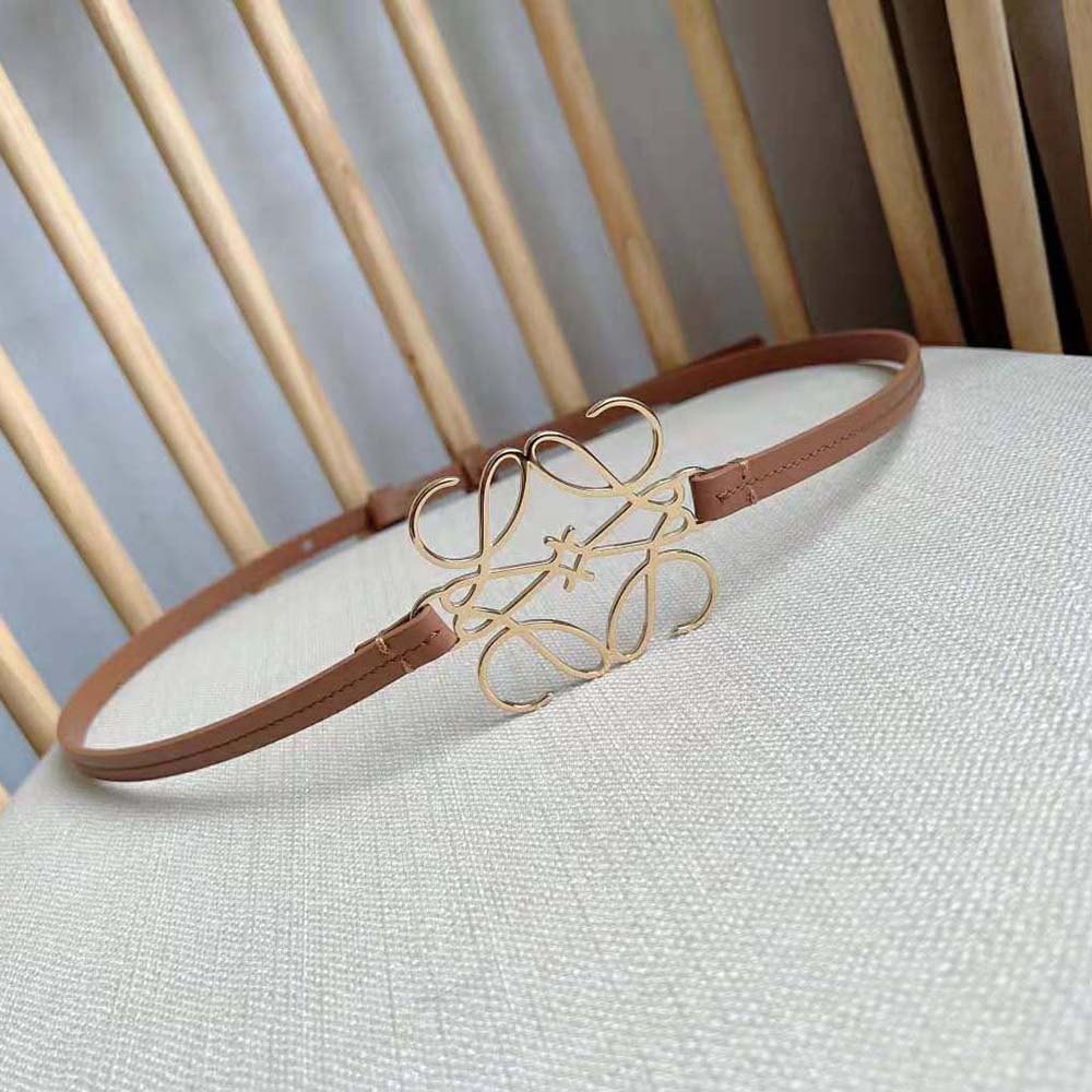 Side view of slim silhouette Loewe Women Anagram Belt in tan calfskin leather