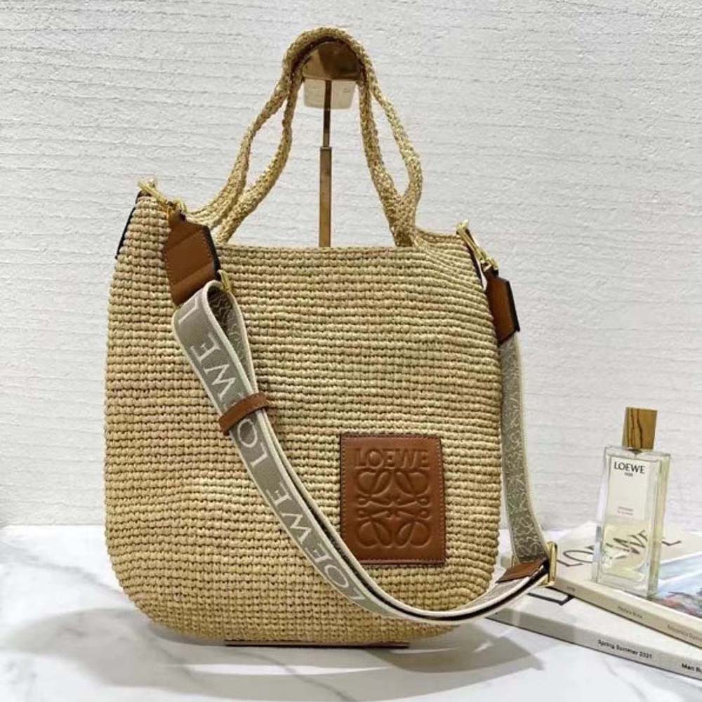 Close-up detail of raffia weave and calfskin on Loewe Mini Slit Bag