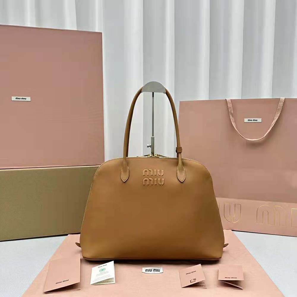 Close-up of embossed lettering logo on Miu Miu Women Leather Bag Brown