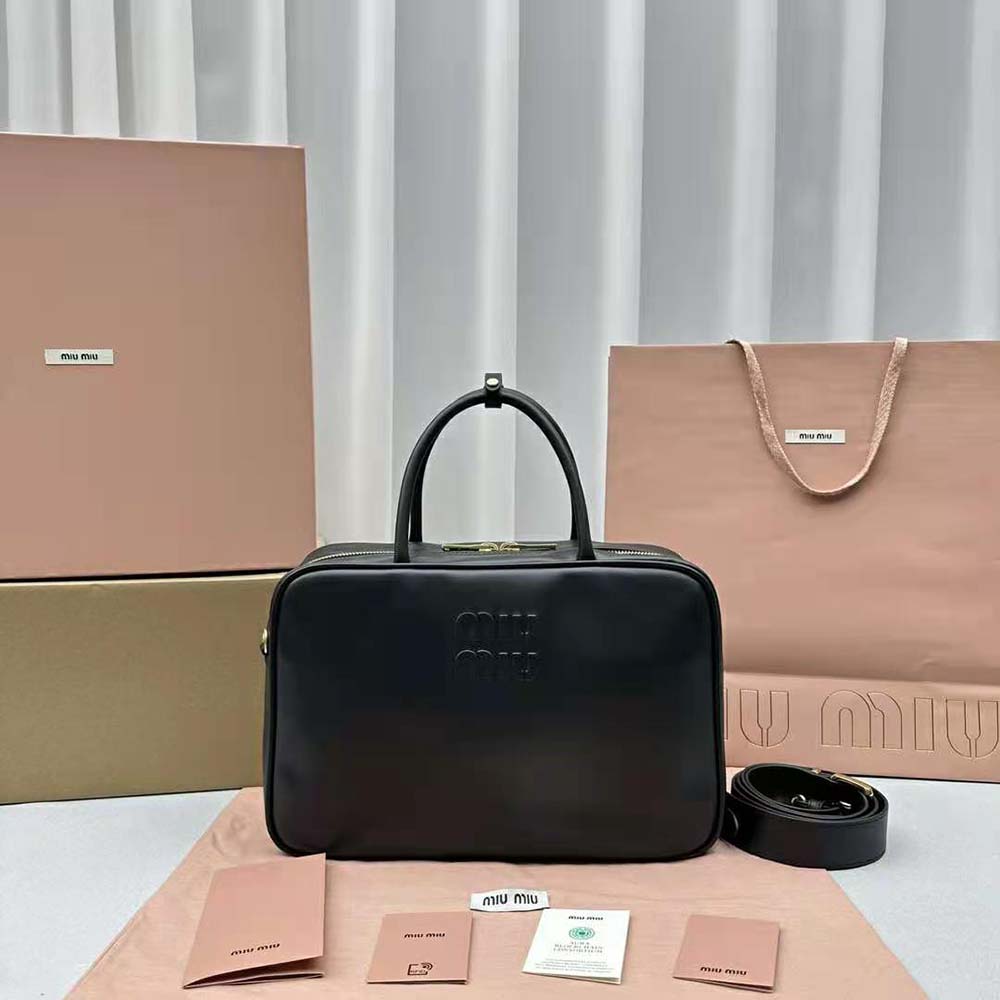 Close-up of embossed lettering logo on Miu Miu Women Leather Top-handle Bag with Embossed Lettering Logo-Black
