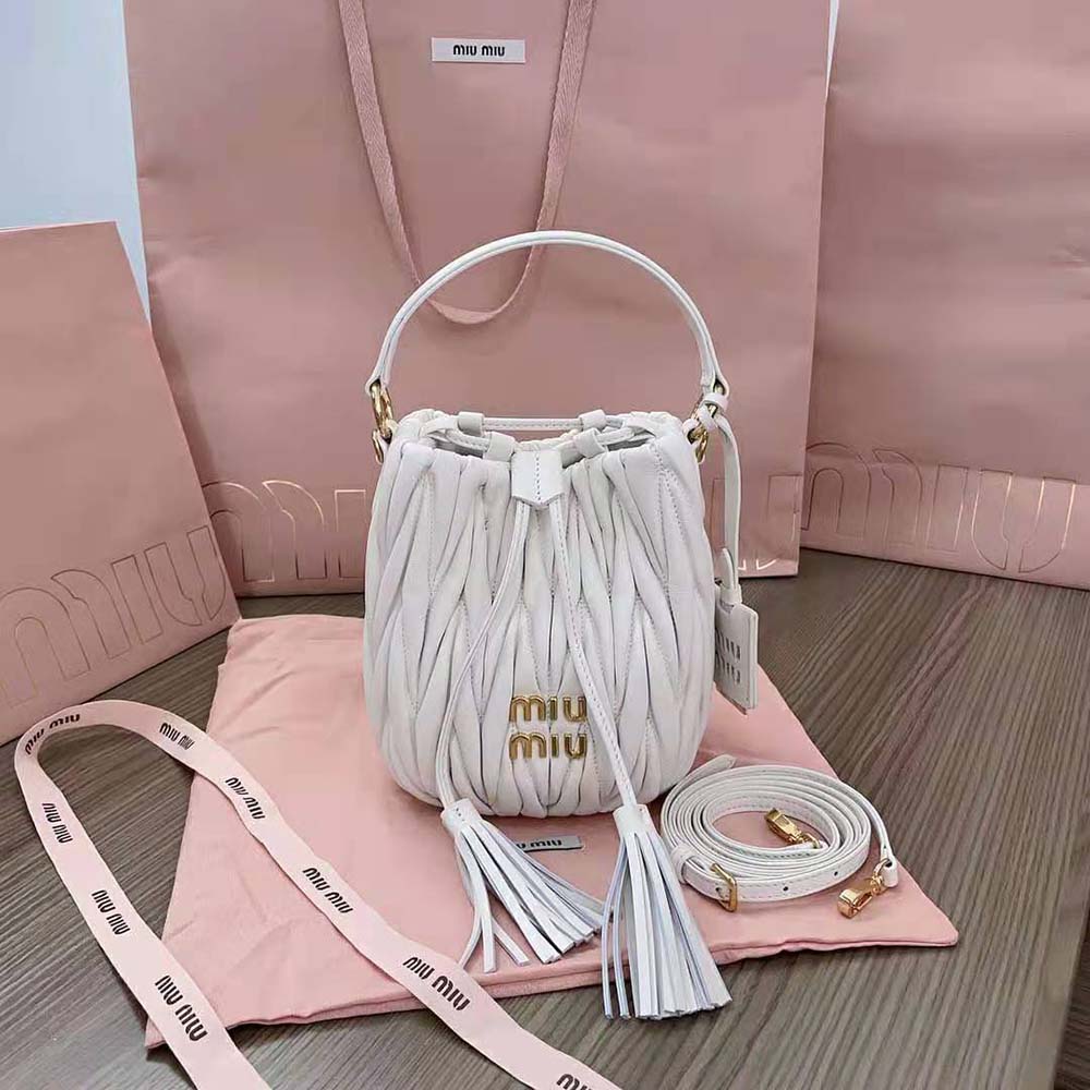Close-up of quilted matelassé nappa leather texture on Miu Miu bucket bag