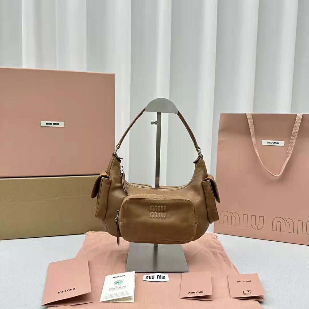 Close-up on embossed lettering logo of Miu Miu Women Pocket Nappa Leather Bag