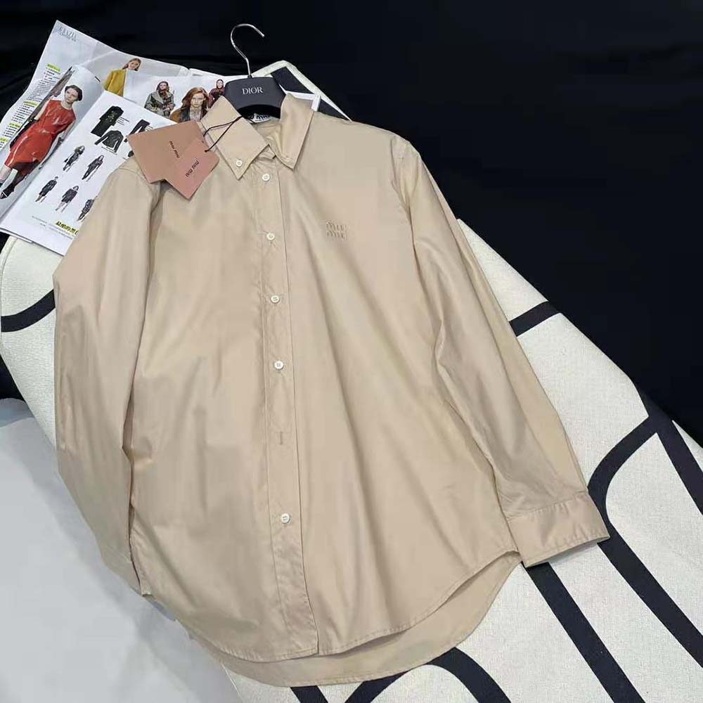 Close-up detail of Miu Miu Women Poplin Shirt button and fabric texture
