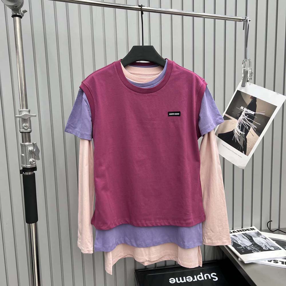 Close-up detail of pink jersey cotton fabric on Miu Miu t-shirt