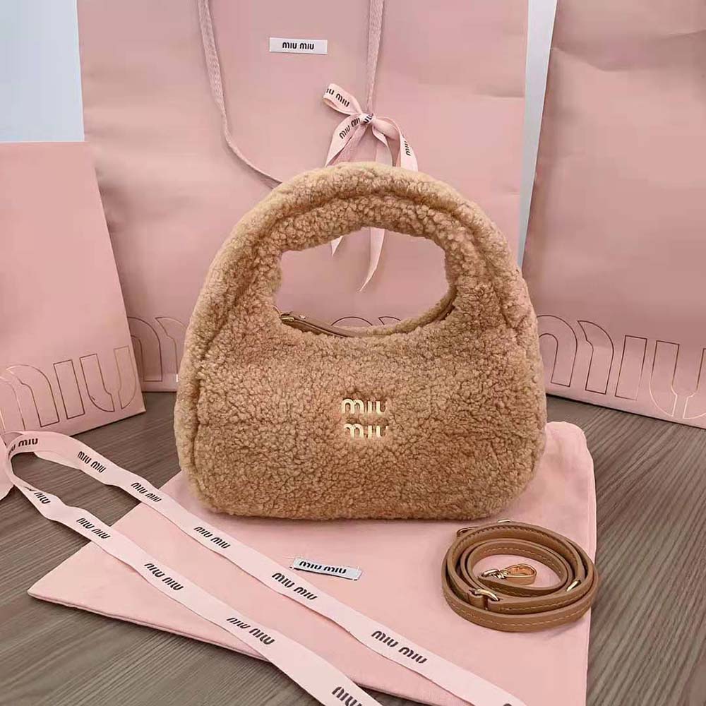 Close-up showing gold hardware on Miu Miu Women Wander Shearling Hobo Bag Sandy