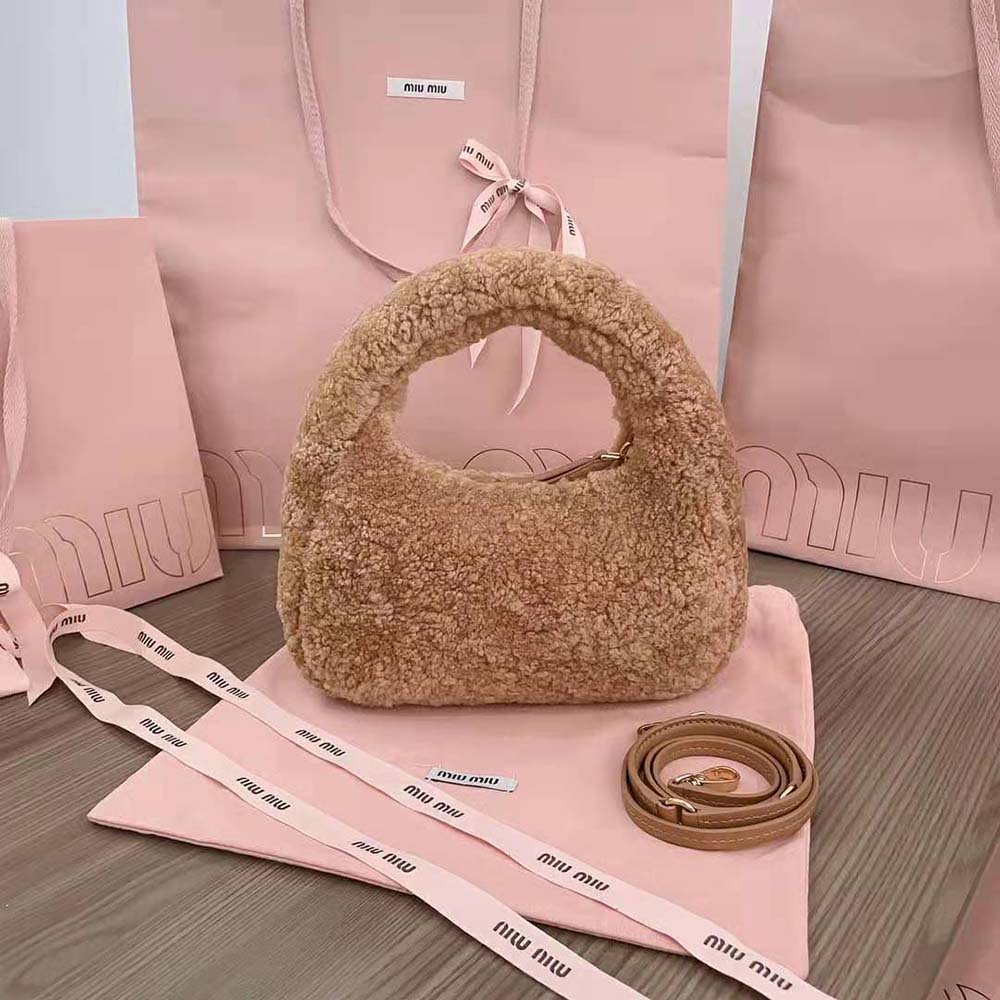 Side angle highlighting sandy shearling texture on Miu Miu Women Wander Hobo Bag