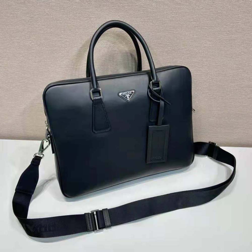 Close-up of silver hardware and leather name tag on Prada briefcase