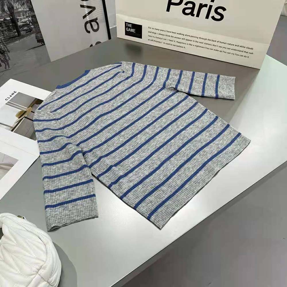 Side angle showing relaxed fit of Prada Women Superfine Wool Sweater