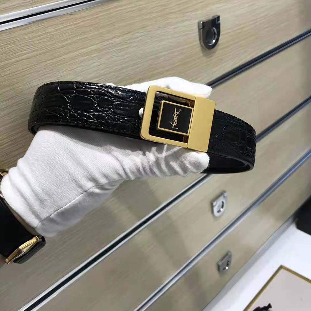 Close-up of gold-tone YSL buckle on La 66 Buckle Belt by Saint Laurent
