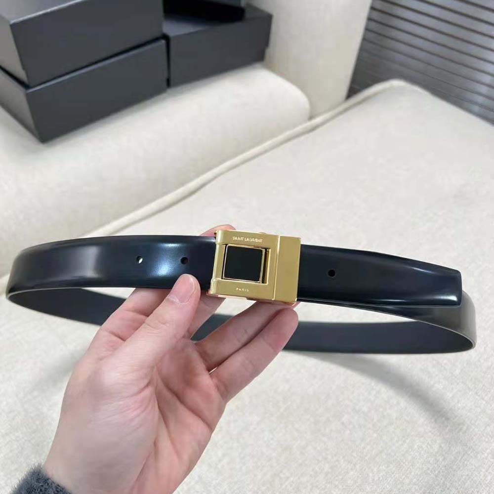 Close-up of gold enamel YSL buckle on Saint Laurent YSL La 76 Belt