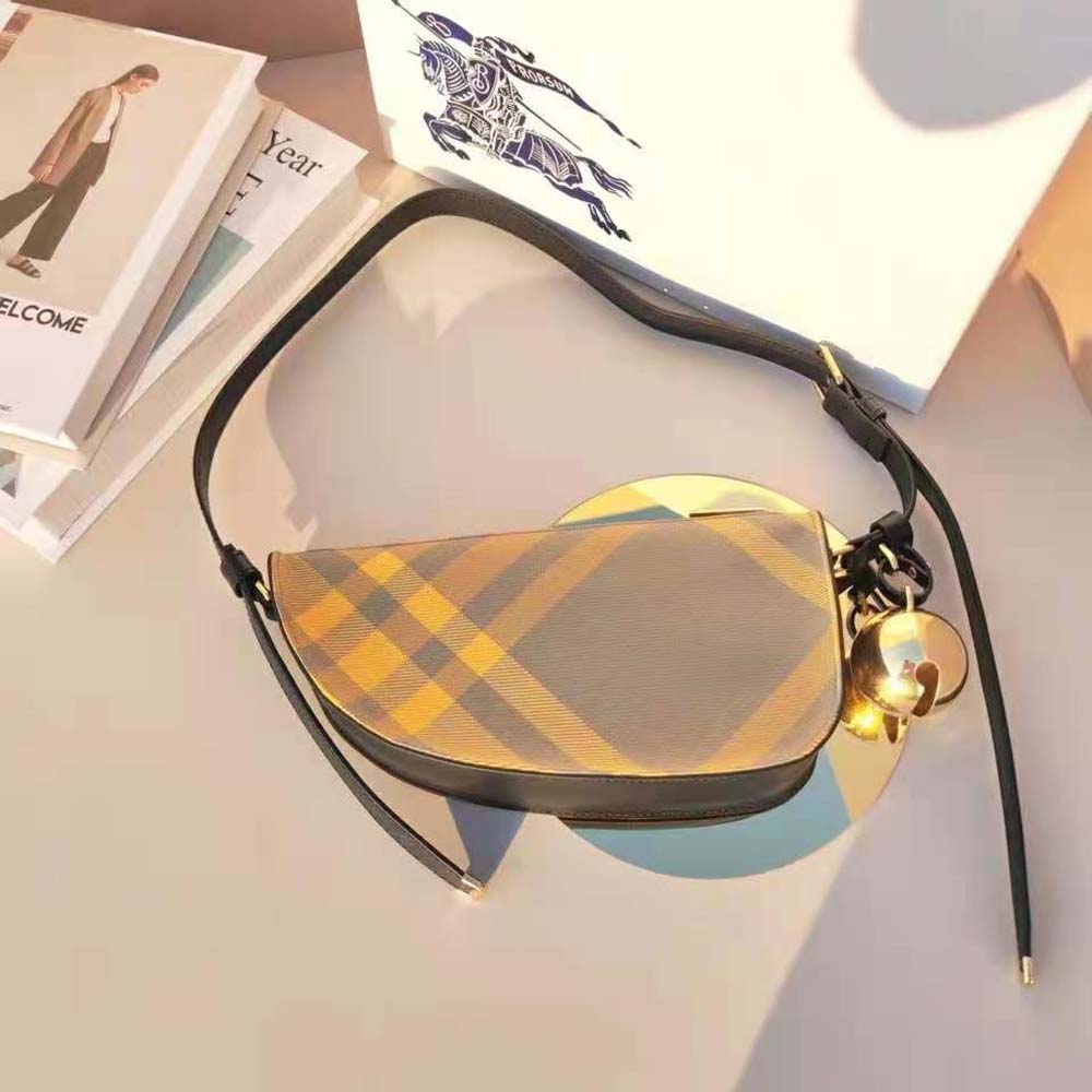 Side angle showing Burberry Women Mini Shield Sling Bag-Yellow silhouette