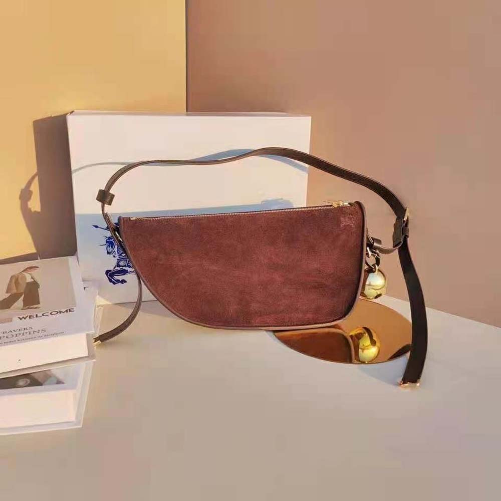Close-up detail of Burberry check and smooth leather on sling bag