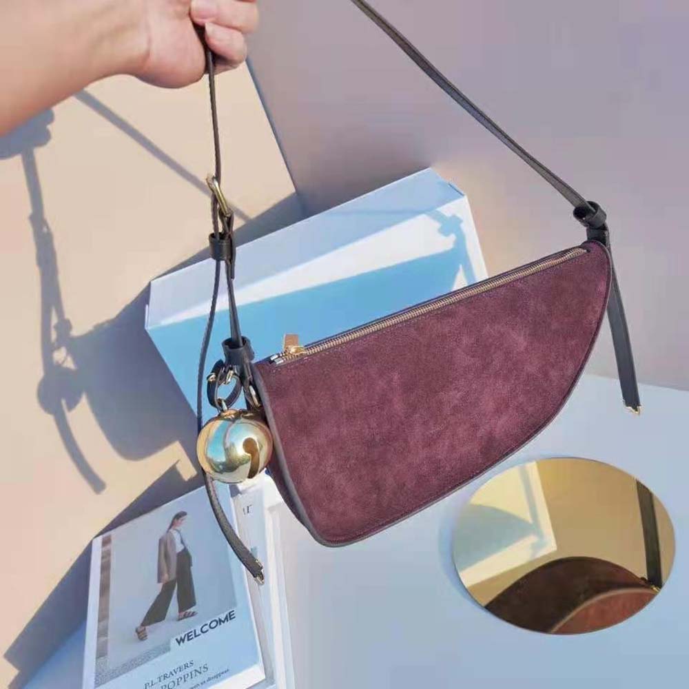 Side angle showing adjustable strap on Burberry women’s sling bag