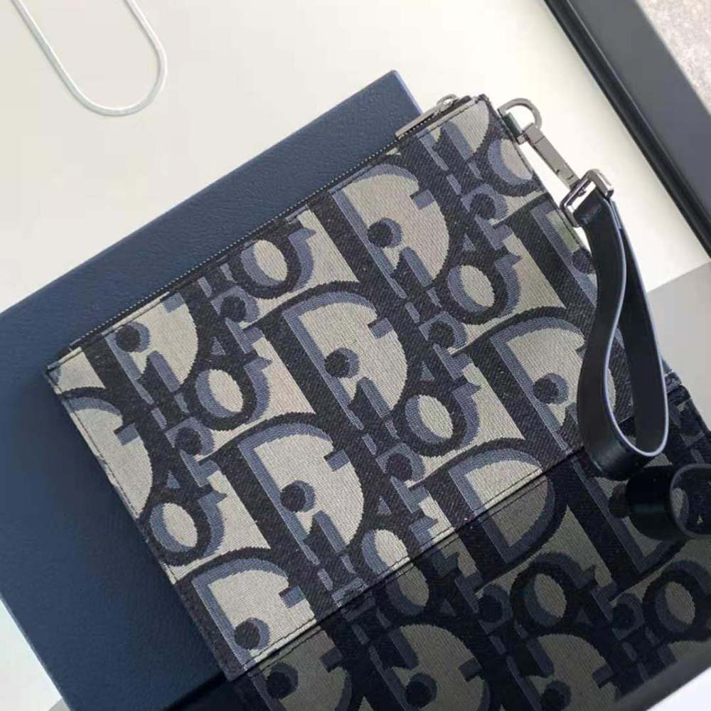 Close-up of Dior Men A5 Pouch fabric texture and silver hardware detail