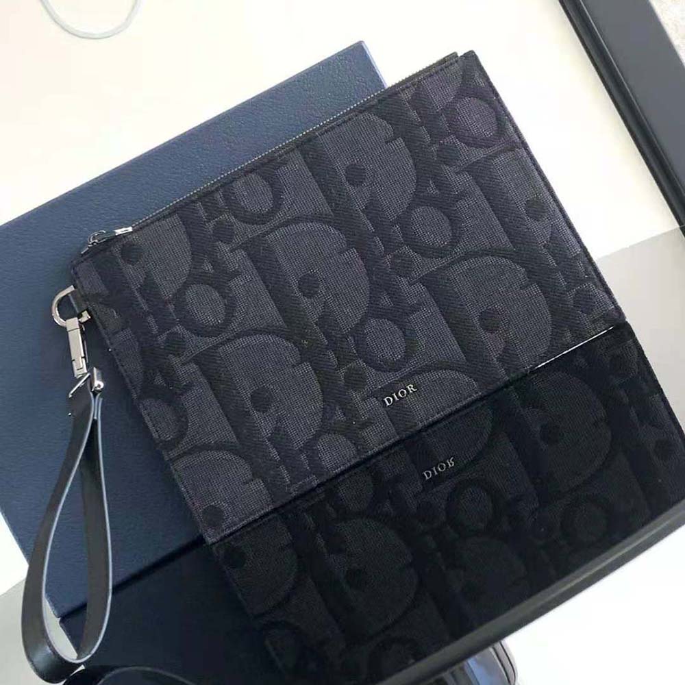 Close-up of jacquard fabric and silver hardware on Dior Men A5 Pouch