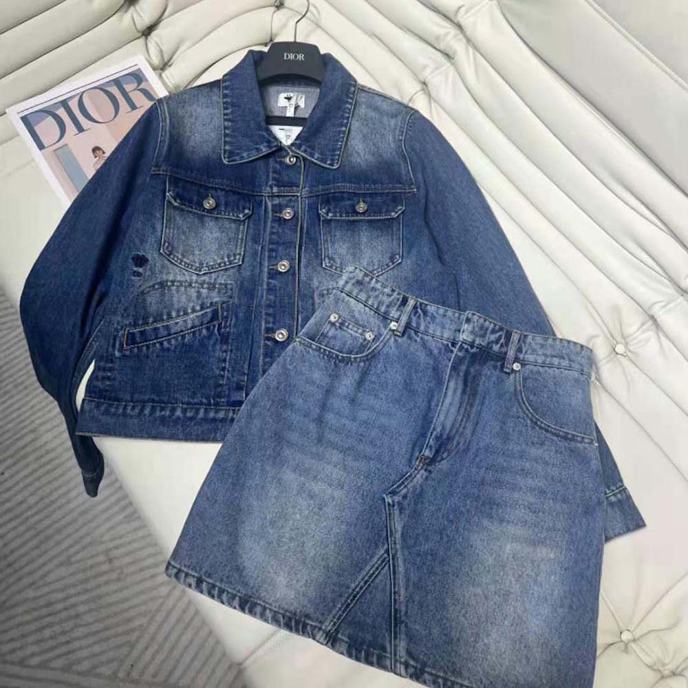 Close-up of signature Dior buttons on blue denim cropped jacket