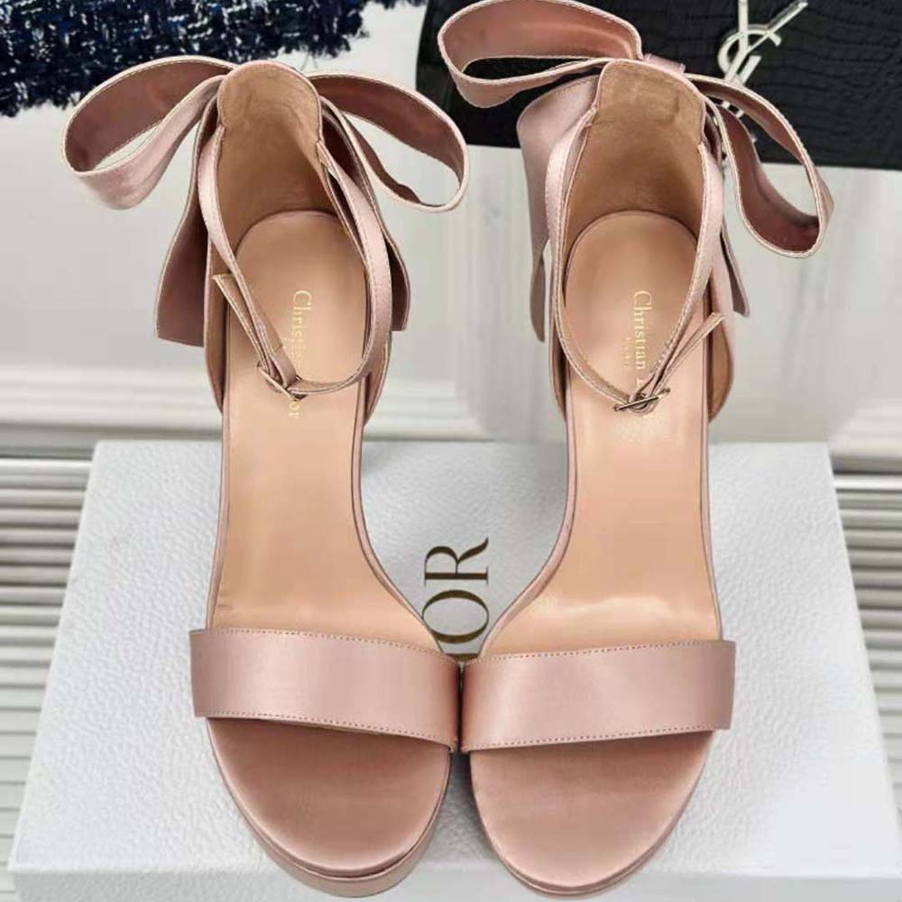 Close-up of rose gold rose Des Vents charm on Dior Women Mlle Dior sandal