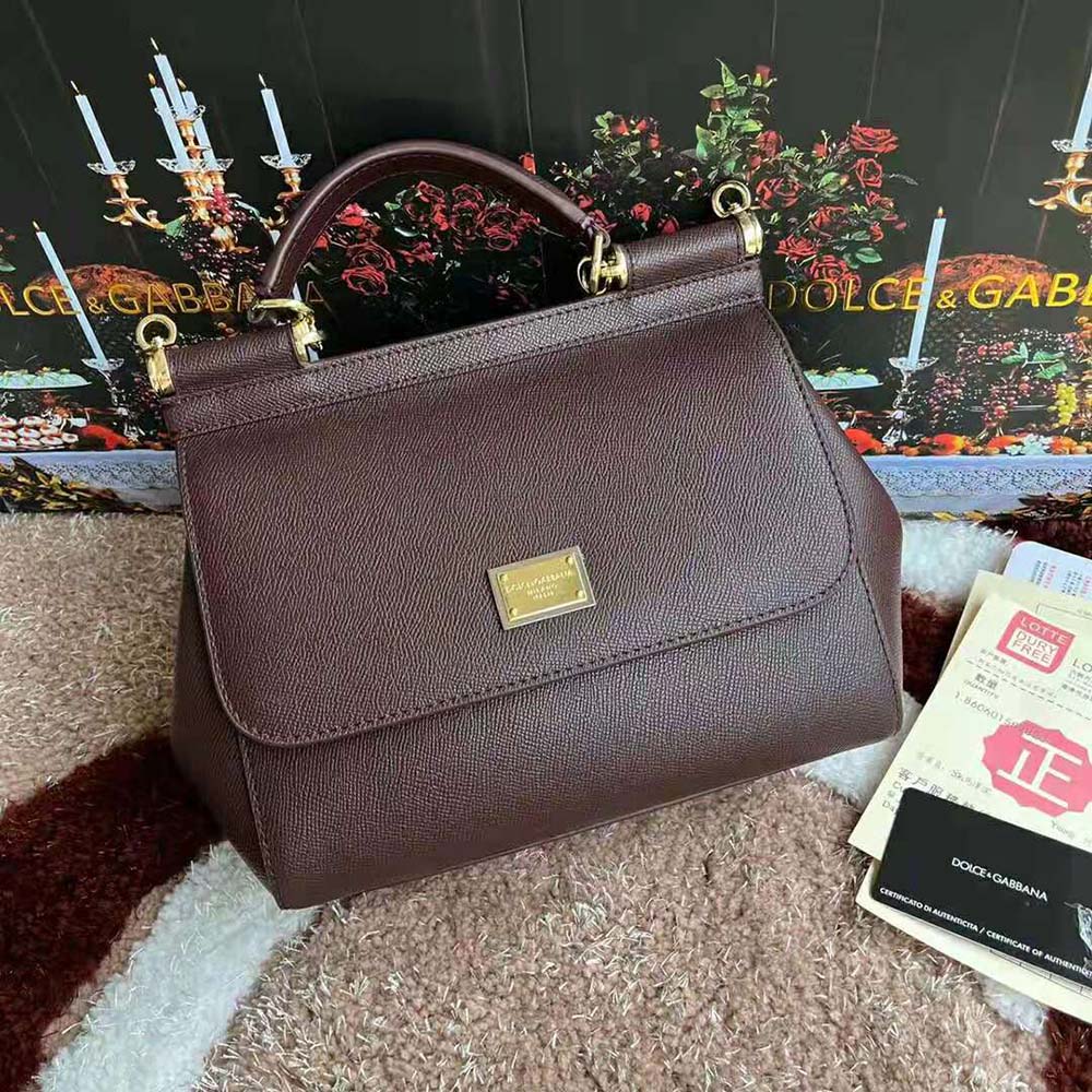 Close-up of gold hardware on Dolce Gabbana D&G Women Medium Dauphine Leather Sicily Bag-Bordeaux