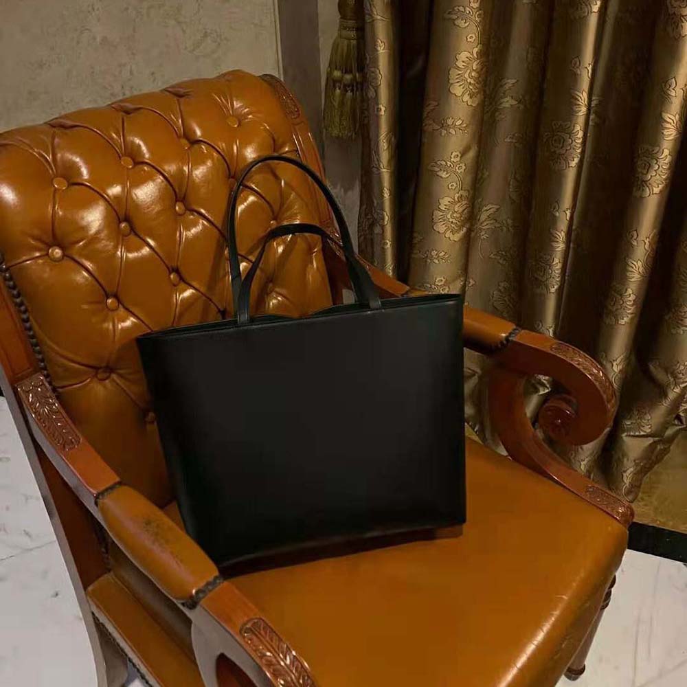 Side angle of Dolce Gabbana D&G Women Small Calfskin DG Logo Bag Shopper-Black showing silhouette