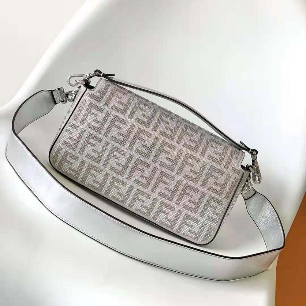 Side angle showing silver leather and shoulder strap of Fendi Women Baguette Bag