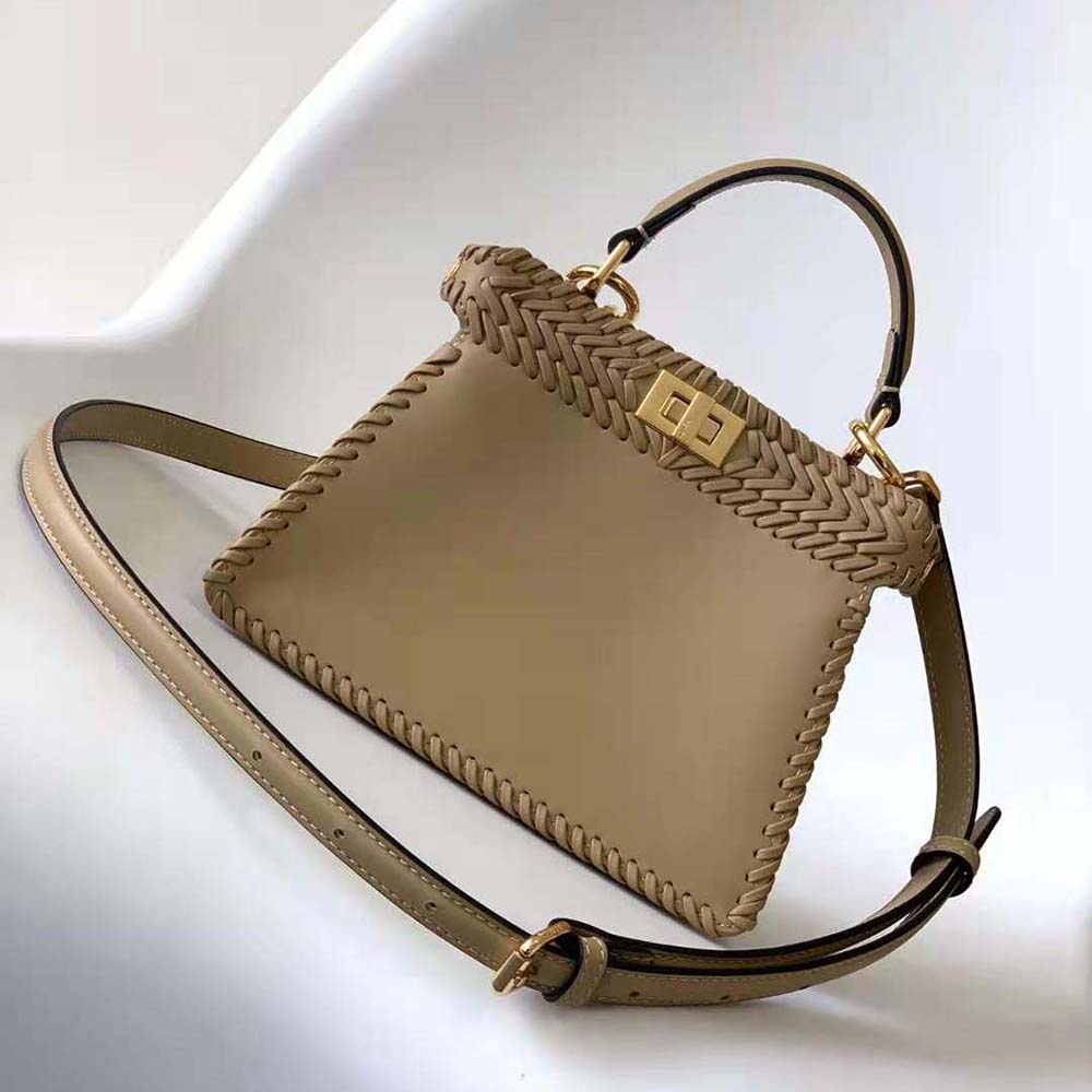 Side angle showcasing padded silhouette of Fendi Women Peekaboo ISeeU Petite Bag