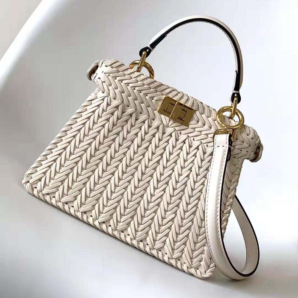 Close-up of gold closure and peekaboo window on Fendi Women Peekaboo bag