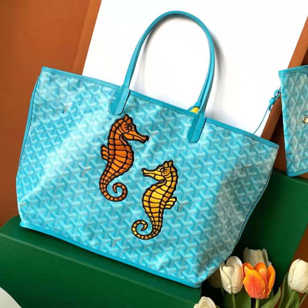Close-up detail of blue seahorse embroidery on Goyard Anjou PM bag