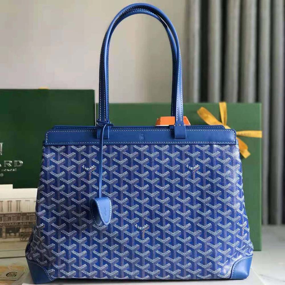 Close-up of blue coated canvas and leather trim on Goyard Bellechasse Biaude PM