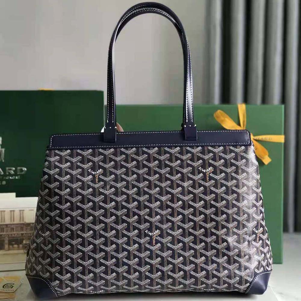 Side angle showing gold-tone hardware on Goyard Women Bellechasse Biaude PM Bag-Navy