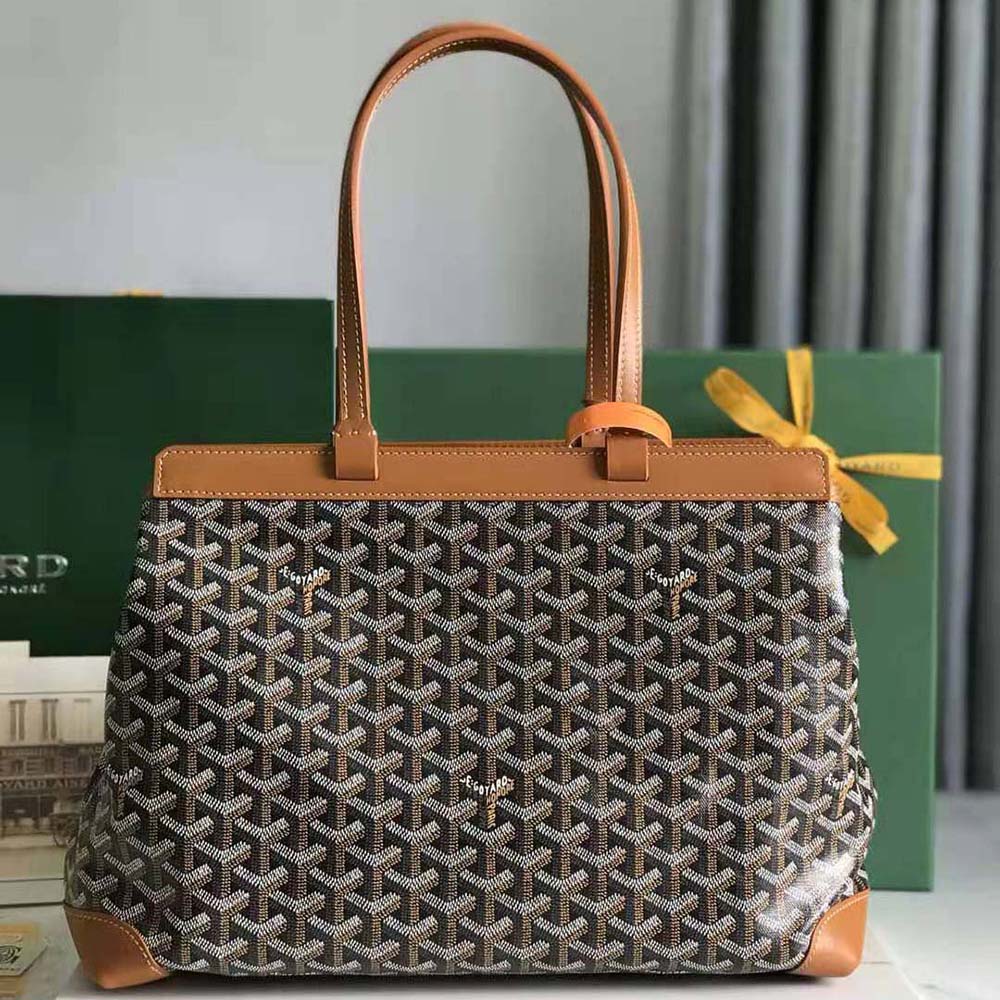 Side angle showing silhouette and signature Goyardine canvas on Bellechasse Biaude PM Bag-Tan