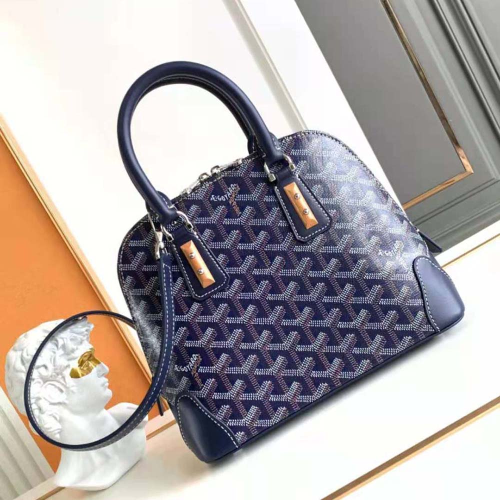 Close-up of Goyardine canvas and gold hardware on Vendôme Mini Bag-Navy