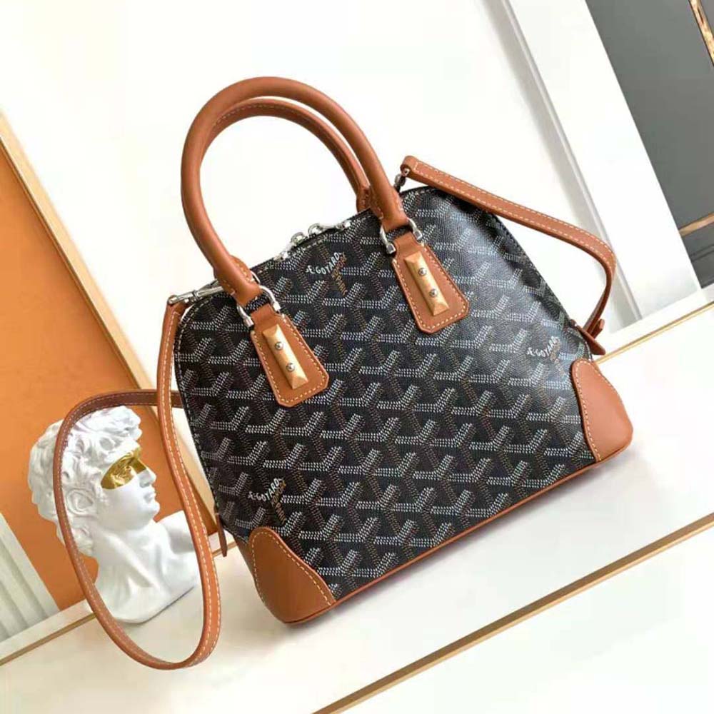 Side angle highlighting gold-tone hardware on Goyard Vendôme Mini Bag-Tan