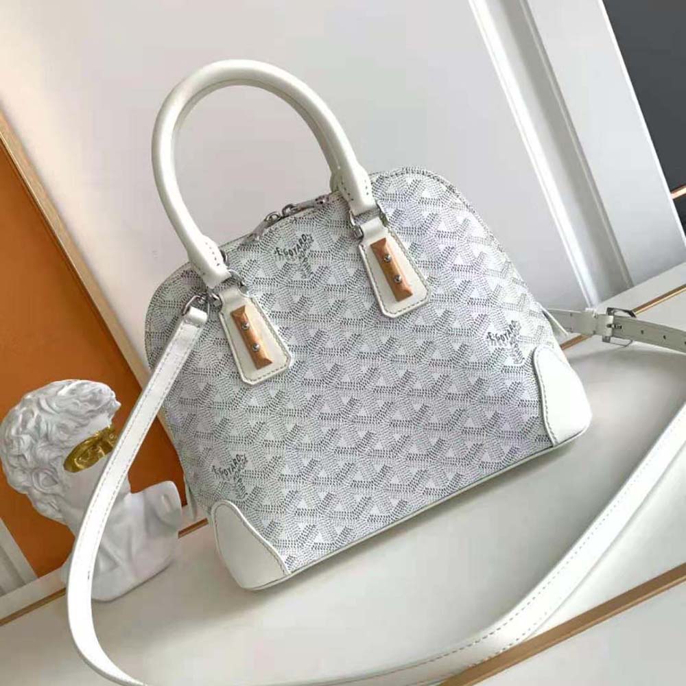 Close-up of Goyard signature chevron pattern on white Vendôme Mini Bag