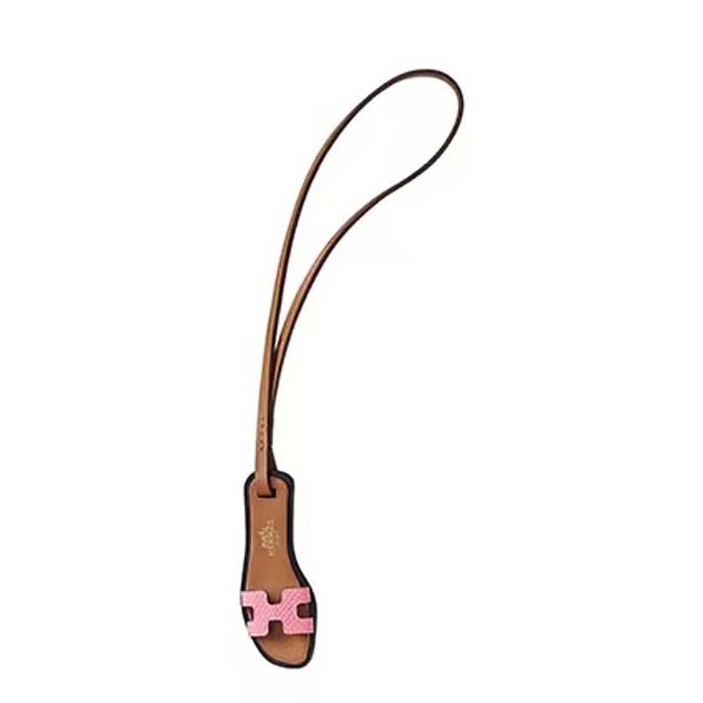 Front view of Hermes Oran Nano Charm-Pink with gold hardware