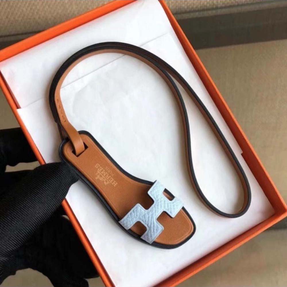 Hermes Oran Nano Charm-White clipped onto white leather handbag strap