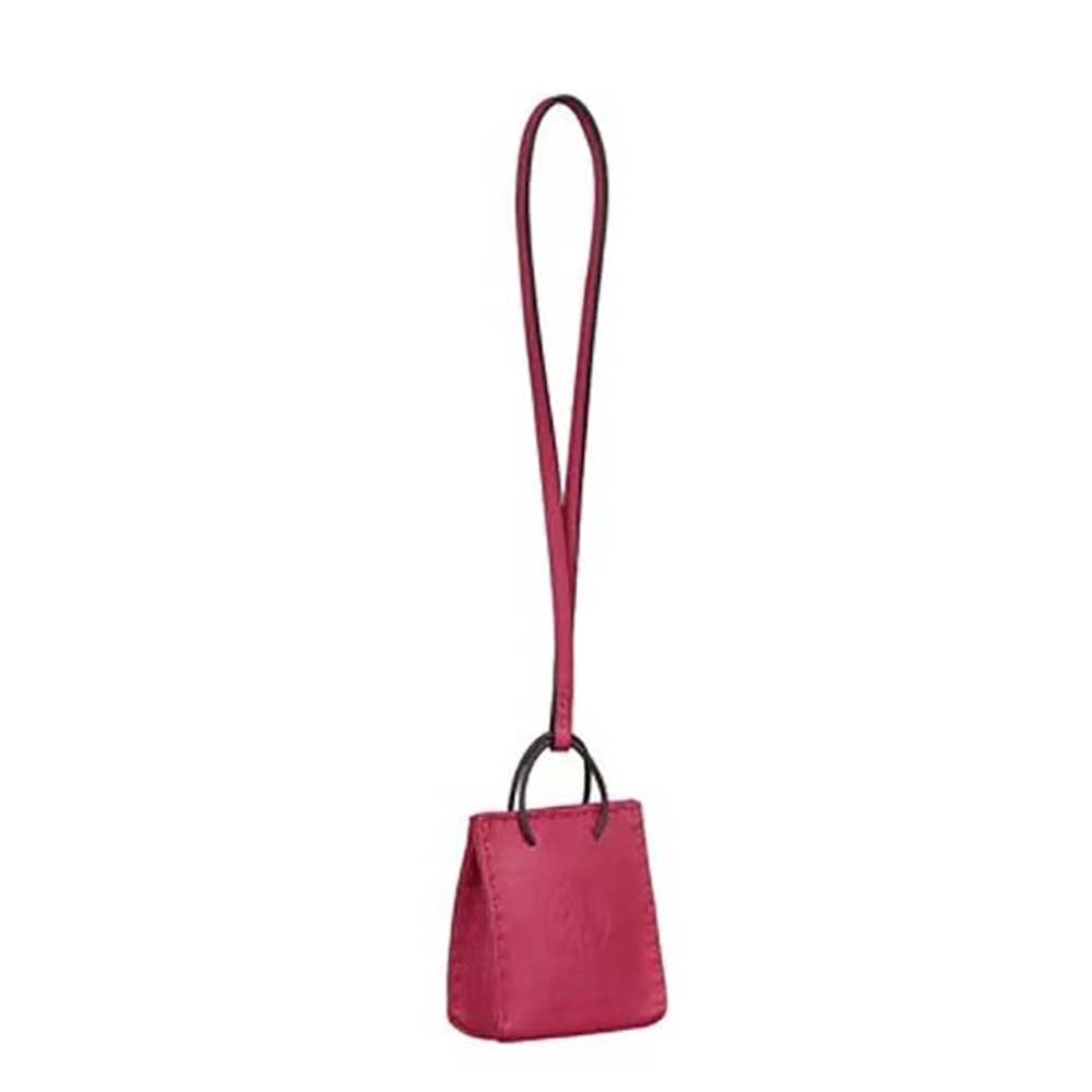 Front view of Hermes Pink Bag Charm showcasing pink leather and silver hardware
