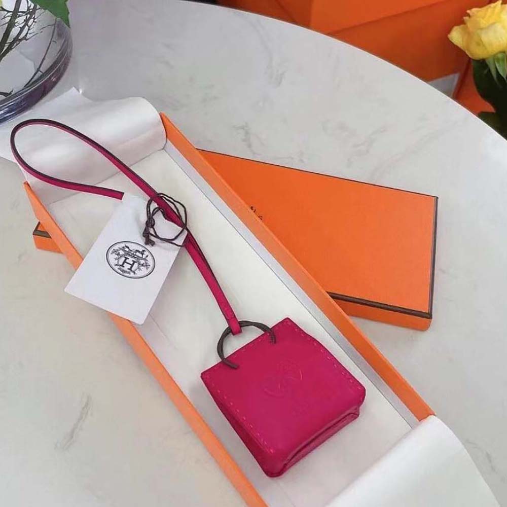 Close-up of Hermes Pink Bag Charm’s hand-stitched edges and polished closure
