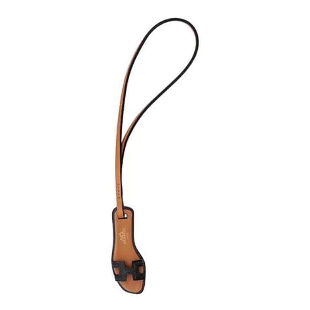 Front view of Hermes Oran Nano Charm-Black showing gold H hardware