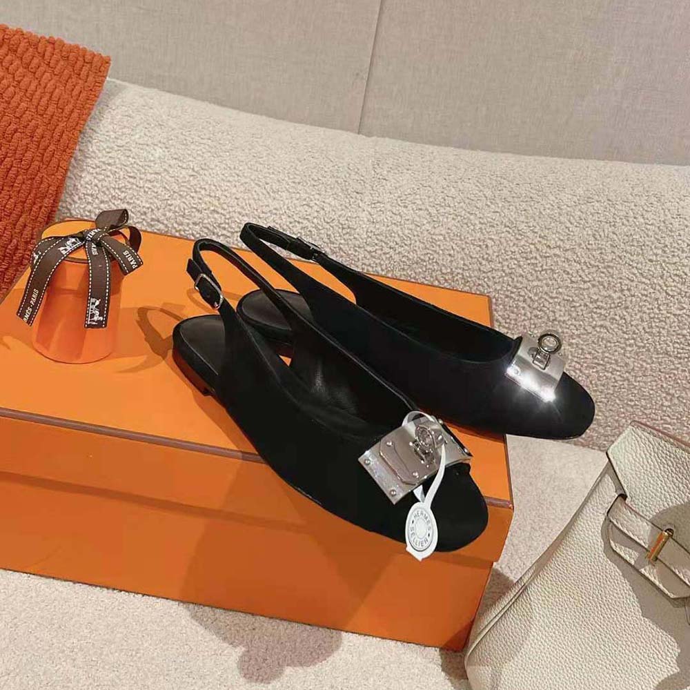Close-up of Hermes signature metal detail on Innocente Slingback toe
