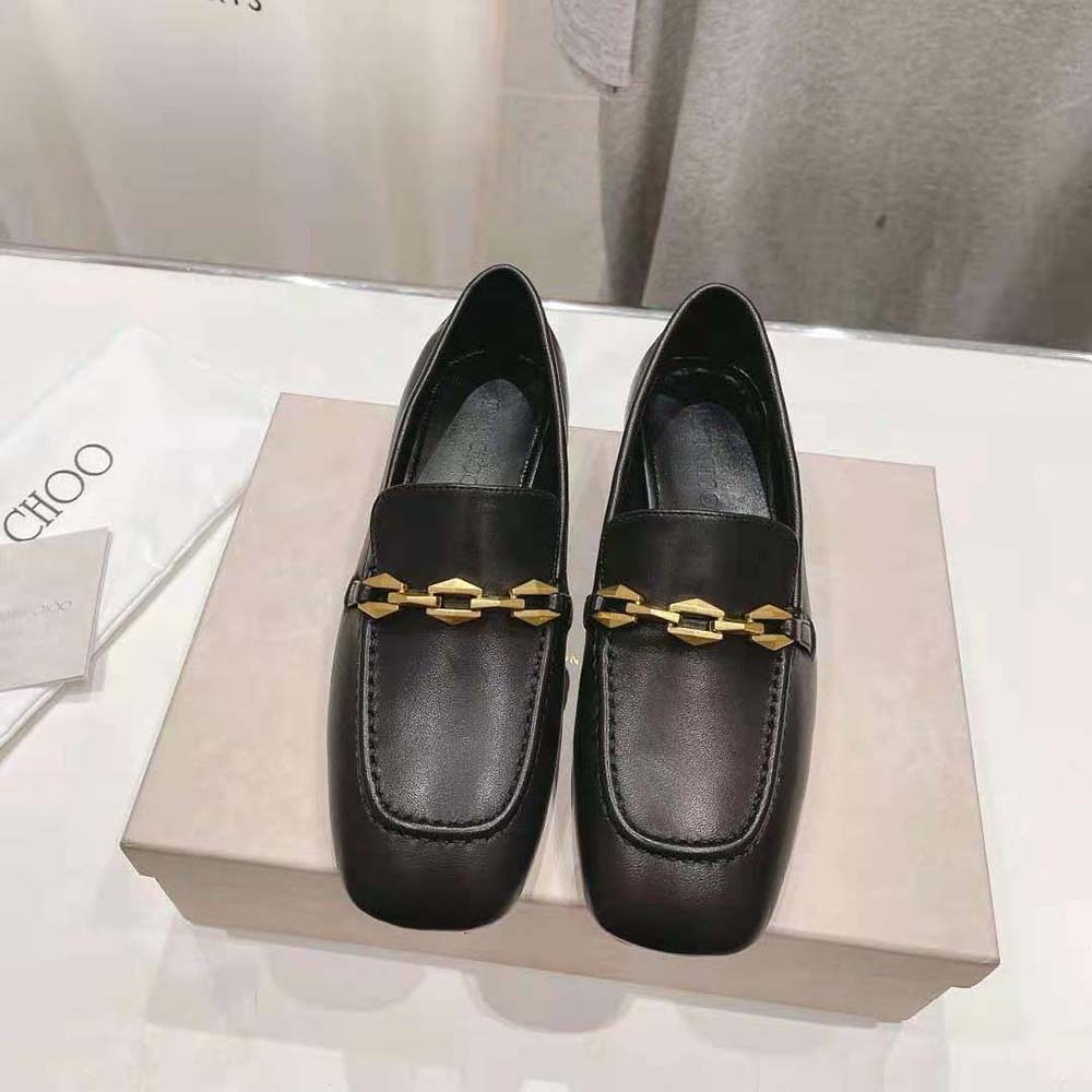 Close-up of gold chain embellishment on Jimmy Choo Diamond Tilda Black loafers
