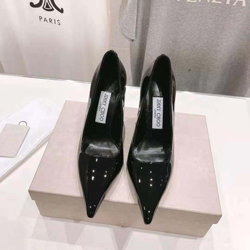 Close-up of patent leather and gold hardware on Ixia 95 pumps