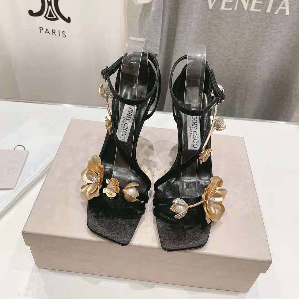 Close-up of metal flower embellishment on Jimmy Choo Zea 95 sandals