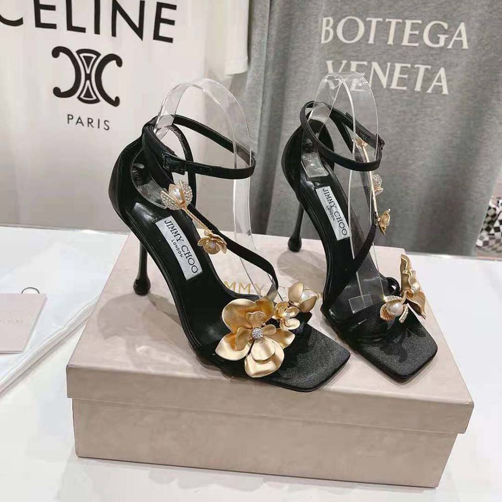 Top-down angle showcasing black satin and ankle buckle of Zea 95 sandals