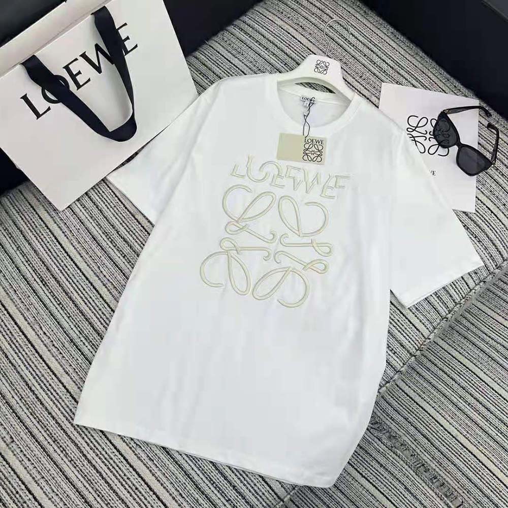 Close-up detail of embossed Loewe logo on white cotton T-shirt
