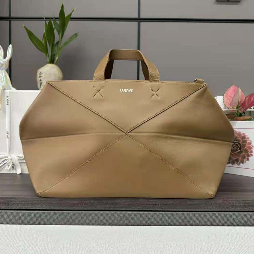 Close-up of Loewe Men XL Puzzle Fold Tote leather texture and silver hardware