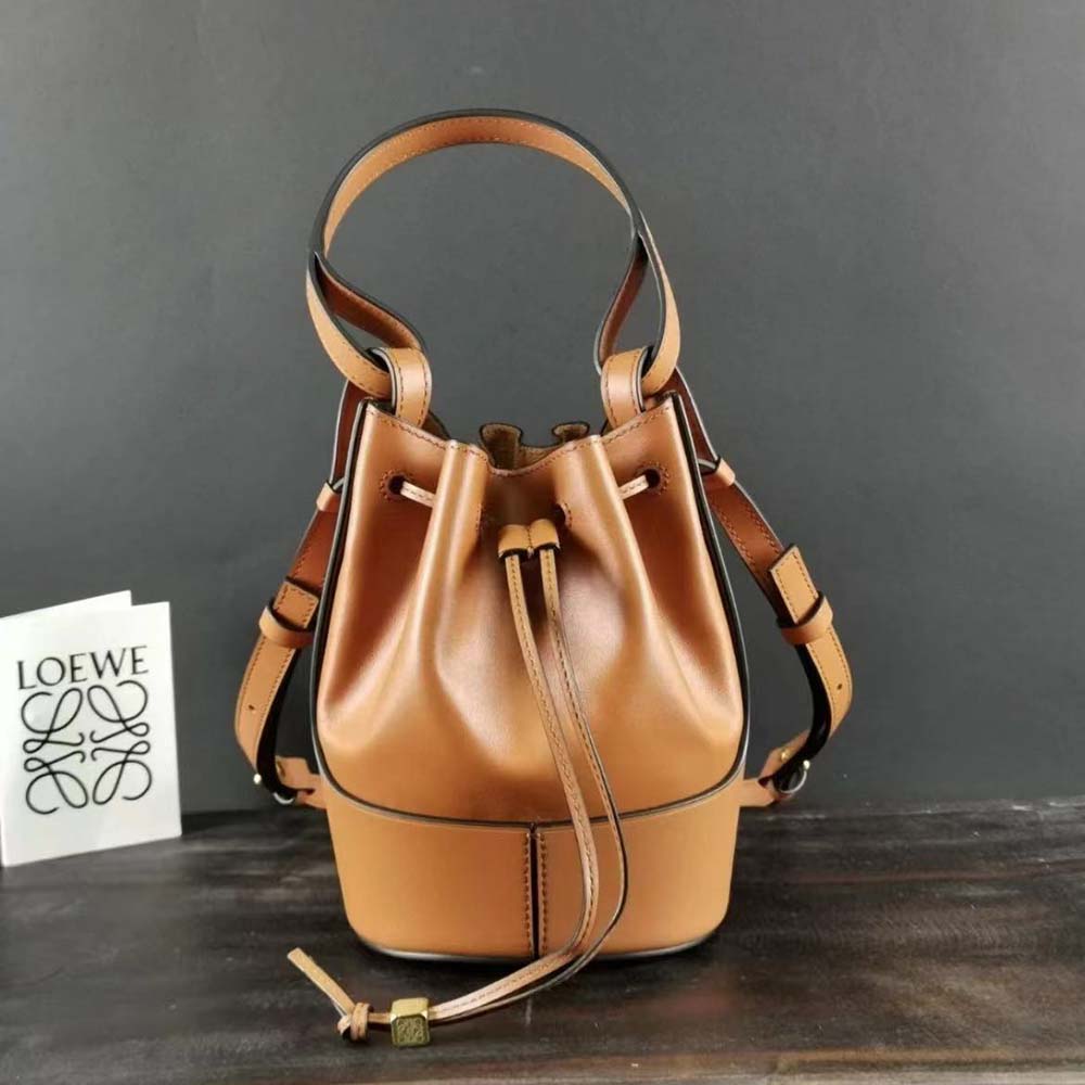 Close-up of magnetic closure and gold-tone hardware on Loewe balloon bag