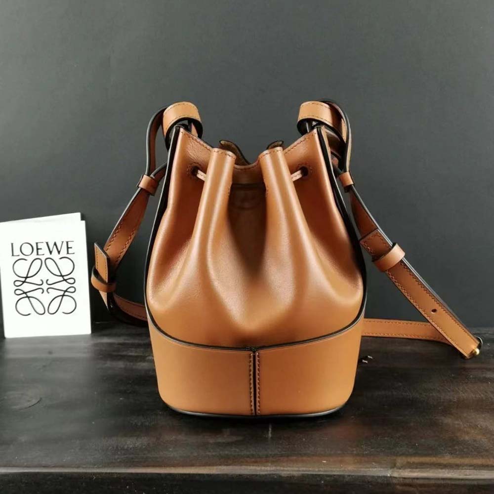 Side angle showing silhouette and texture of Loewe Mini Nano Balloon Bag