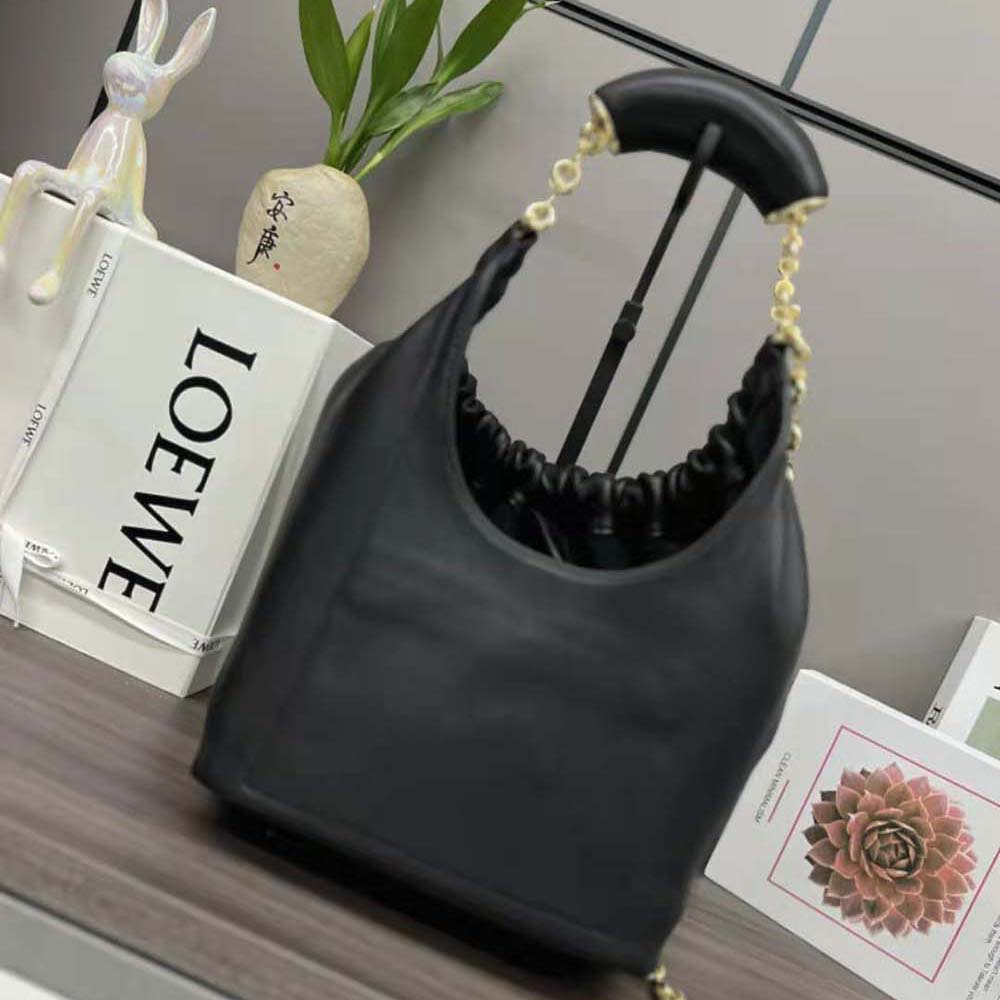 Side angle highlighting sculptural silhouette of Loewe Women Small Squeeze Bag